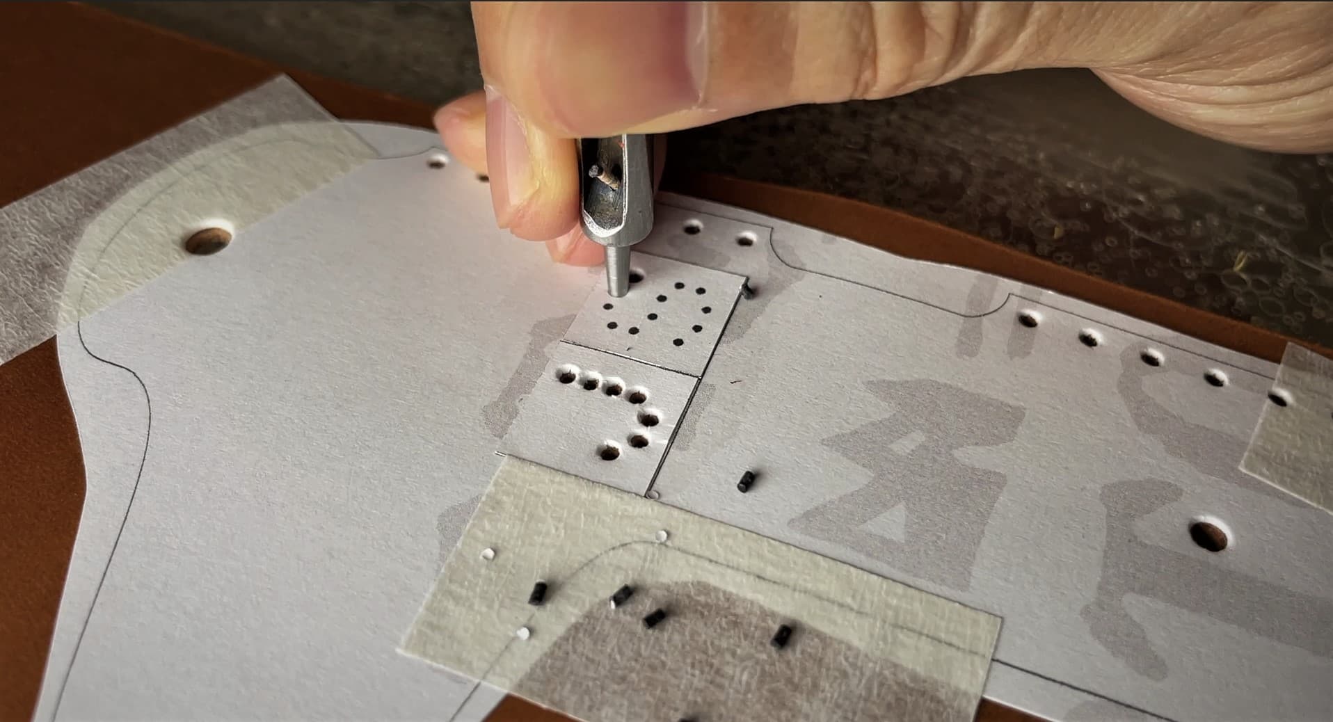 Testing hole placement on a leathercraft pattern
